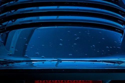 A blue car with water droplets all over