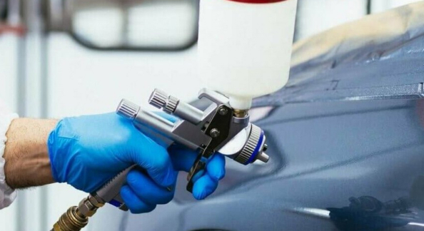  Expert painting a car
