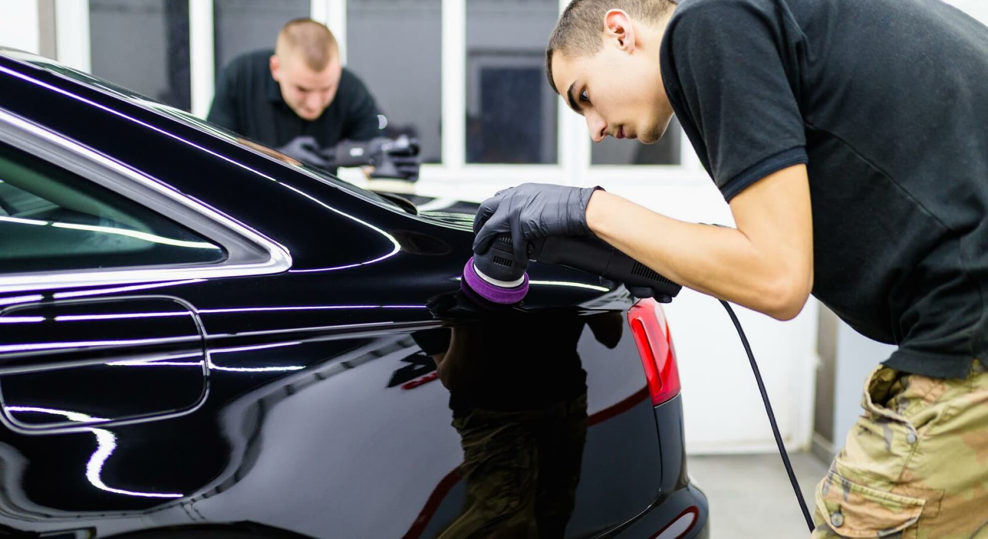 professionals applying ceramic coating